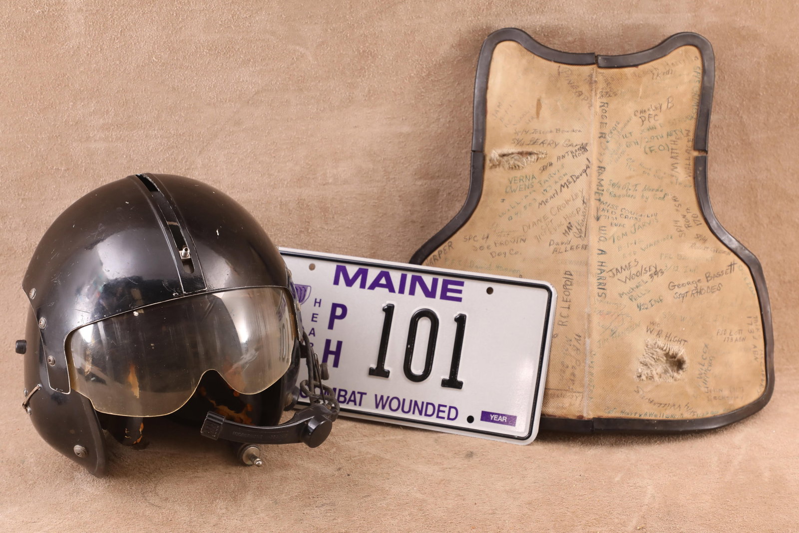 US Army Vietnam 170th Assault Helicopter Company Painted APH-5 Flight Helmet, Chicken Plate Grouping: Good Condition. Missing the screw pull down knob from the flight helmet visor. Heavy ongoing deterioration to the black rubber covering and foam interior padding of the ear cups. Moderate fraying to t