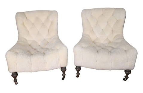 John Derian Shearling Chairs: A pair of tufted shearling lounge chairs designed by John Derian. Purchased from Revival, Chattanooga TN. Covered in authentic ivory-colored shearling sheepskin, button-tufted detail, nature parchment