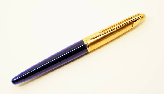 Waterman Edson Sapphire Blue Rollerball Pen: Waterman Edson rollerball in Sapphire Blue. The Waterman Edson has a classic late 1990’s retro-Art Deco design. Overall excellent condition with minor cap and barrel wear.