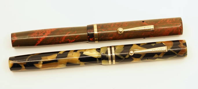 Chilton Boston Fountain Pens (2): Chilton Boston made flattop fountain pens in red mottled hard rubber and Black and Pearl celluloid. Both pens complete with proper nibs. Some discolouration to both pieces, clip slightly loose on Blac