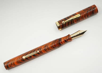 Waterman Ideal 58 Red Ripple Fountain Pen: Waterman Ideal model 58 lever fill Red Ripple fountain pen. The Ripple pattern appears to have first launched in the Waterman Pen Prophet magazine in 1926. Waterman was competing with Sheaffer and Par