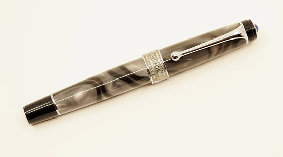 Aurora Optima Europa Limited Edition Fountain Pen: Aurora Optima Europa fountain pen, without box or papers. This limited edition fountain pen was limited to 7500 (4082/7500) and has a medium 14k Aurora nib. The wide silver band shows an industrial Eu