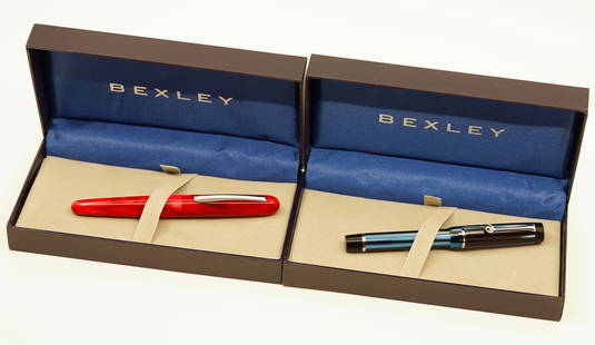 Bexley Imperial and Elegancia Fountain Pens: Bexley Pens (2) with box and papers. The lot consists of an Elegancia in Blue Shell with a broad nib and Imperial International in Custom Red Pearl with a broad nib. Overall near mint, both pens are u