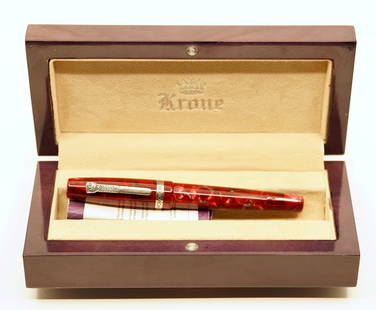 Krone Red Boulder Fountain Pen, Boxed: Krone Red Boulder fountain pen, boxed. It has red hues with grey veining, silver trim and a fine 18k Krone nib with piston filler. Overall near mint with some wear to the box.