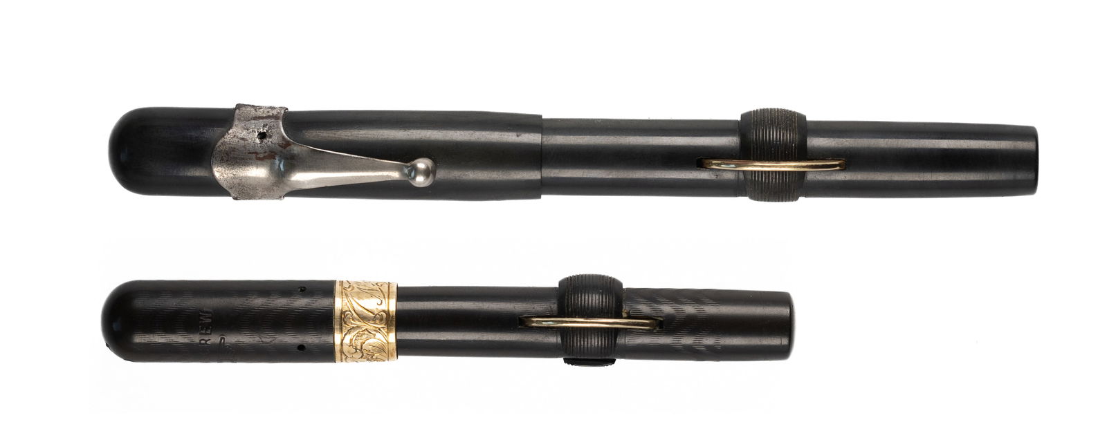 Conklin Crescent Filler Early C34 & P3 Fountain Pens: Conklin Crescent filler black hard rubber fountain pens. An early pair of Crescent fillers, slip cap C34 with accommodation clip and fine Conklin Toledo 3 14 K nib along with 3PS with raised barrel th