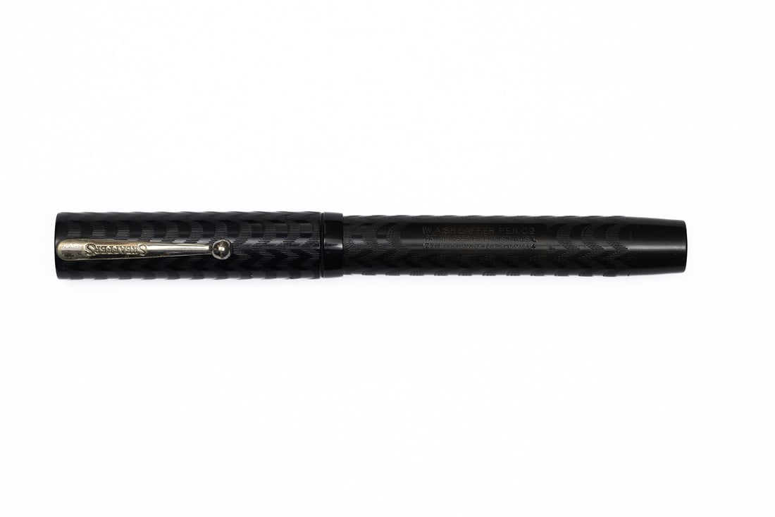 Sheaffer Flattop Senior Black Chased Hard Rubber Fountain Pen: Sheaffer flattop senior black chased hard rubber fountain pen. Late model large chased hard rubber Sheaffer flattop wth Sheaffer's clip and nickel trim. Deep chasing and imprints, some spots of wear t