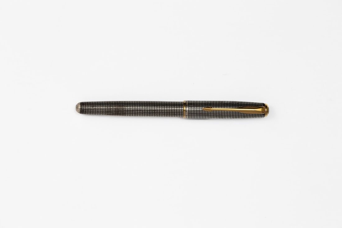 Parker Sonnet Cisele Sterling Silver Fountain Pen F 18K Nib: Parker Sonnet Cisele fountain pen from 1997. Parker Sonnet Cisele in sterling silver with medium 18K fine nib. Length 5 1/4” and 5 3/4” posted, filling mechanism cartridge/converter fill (