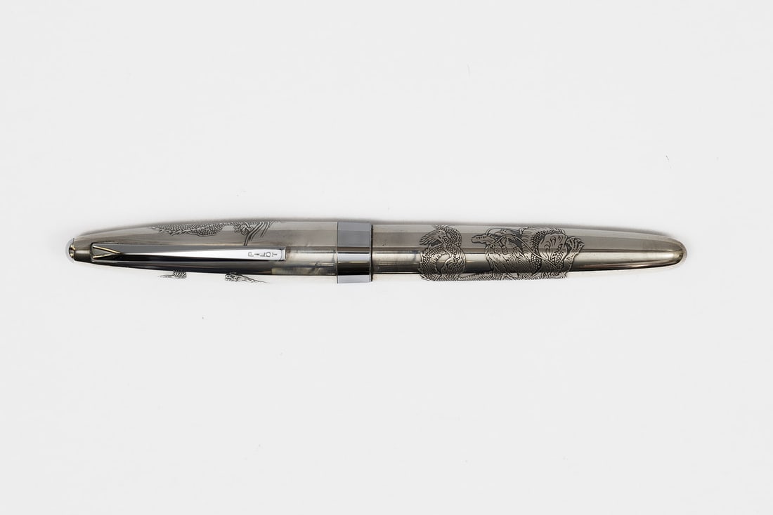 Pilot Art Craft Silvern Sterling Silver Ryu Dragon Fountain Pen: Pilot Art Craft Silvern sterling silver Ryu (dragon) fountain pen. This was part of Pilot's Art Craft Silvern collection. There are two dragons on the pen, one on the cap and one on the barrel with me