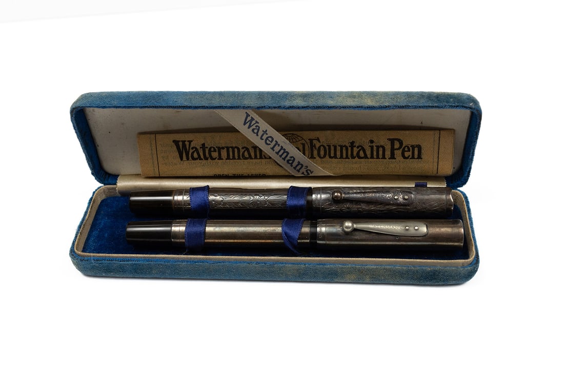 Waterman 452 Sterling Silver Overlay Fountain Pens (2): Waterman 452 sterling silver overlay fountain pens with early Waterman box with papers. Pansy pattern with sterling clip, cap and barrel, small dings around edge of cap and marks near lever, 14K Water