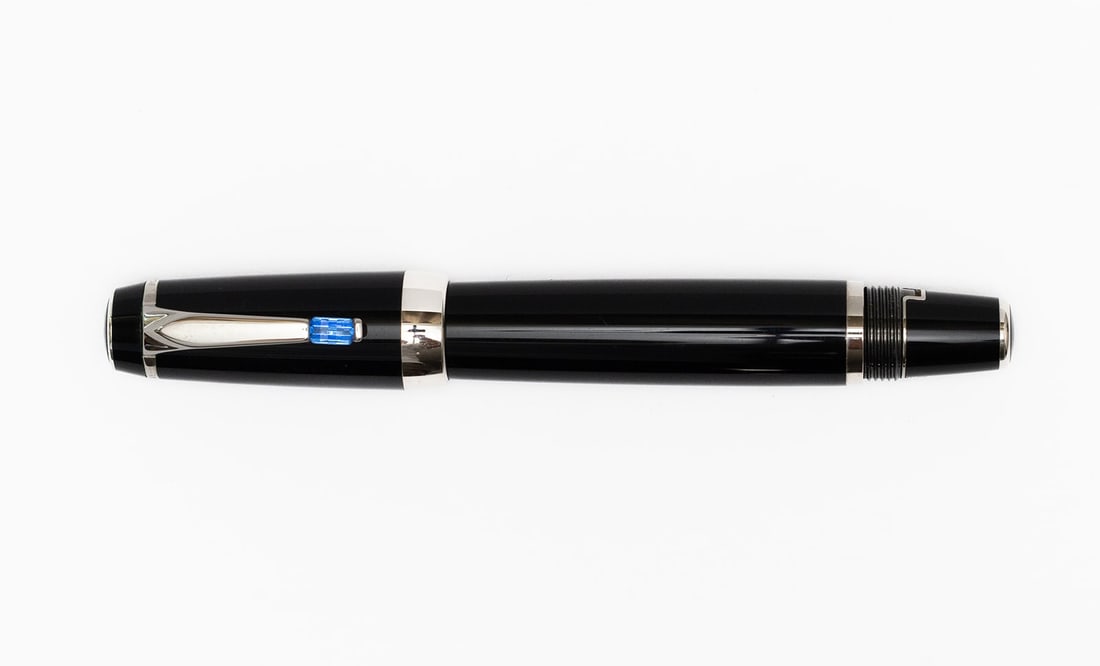 Montblanc Boheme Blue Sapphire Platinum Trim Fountain Pen: Montblanc Boheme blue sapphire jewel platinum trim fountain pen with box, outer box and papers. Platinum plate trim with blue jewel, threaded end on fountain pen for cap to post and to extend the nib 