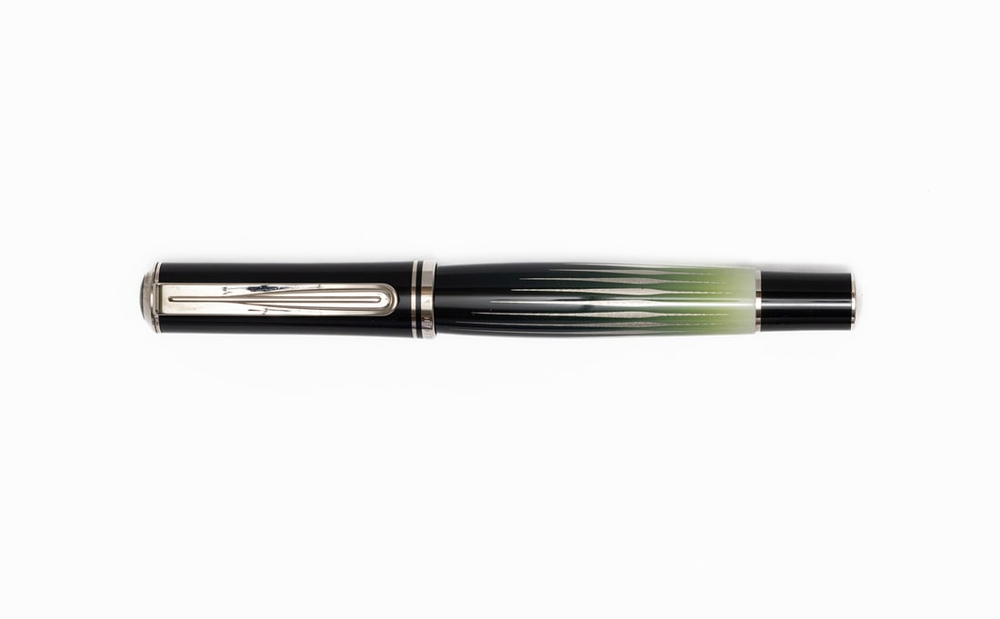 Pelikan M640 Polar Lights Fountain Pen: Pelikan M640 Polar Lights fountain pen with box and papers. M640 model with Polar Lights design with tapered barrel and 18K medium nib. Length 5 1/4” and 6 1/4” posted, filling mechanism p