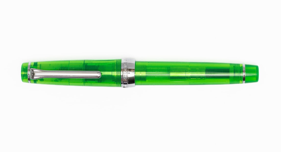 Sailor Pro-Gear Transparent Green Fountain Pen, Boxed: Sailor Pro-Gear transparent green fountain pen with box, outer sleeve and papers. Sailor 1911 Pro-Gear in transparent green with chrome trim and 21K H-F (hard fine) Sailor nib. Length 5” and 5 7