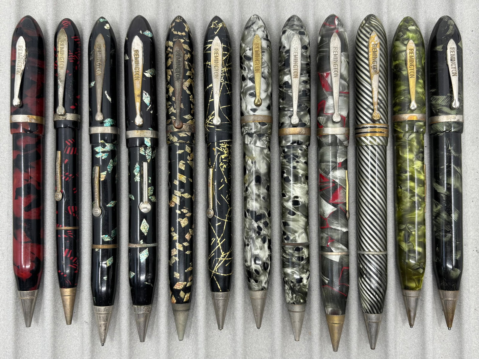 Remington Sheaffer Celluloid Fountain Pen/Pencil Combos (12): Remington fountain pen/pencil combinations (16). Remington combos in variety of designs and colours, bright coloured celluloid combos from the 1930’s. Some of these patterns are the same materia