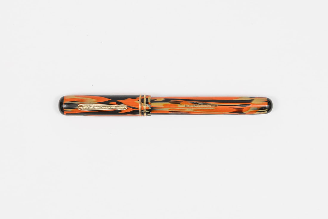 Conklin Orange-Black Halloween Streamlined Fountain Pen: Conklin Halloween fountain pen, full size. This pen in Conklin’s 1930 catalog is described as Black & Orange Long Version with Clip, most collectors today refer to this pattern as Halloween. Bright 