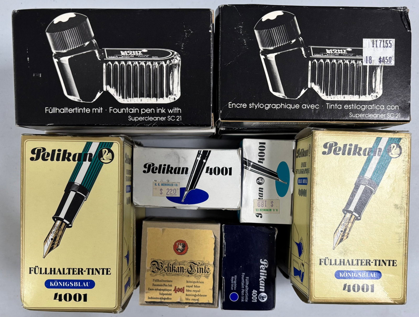 Montblanc & Pelikan Assorted Fountain Pen Ink Bottles (14): Montblanc and Pelikan fountain pen ink. Six Montblanc bottles, three Royal Blue and three Blue/Black along with four large Pelikan blue ink bottles and four other Pelikan ink bottles. Overall mixed co