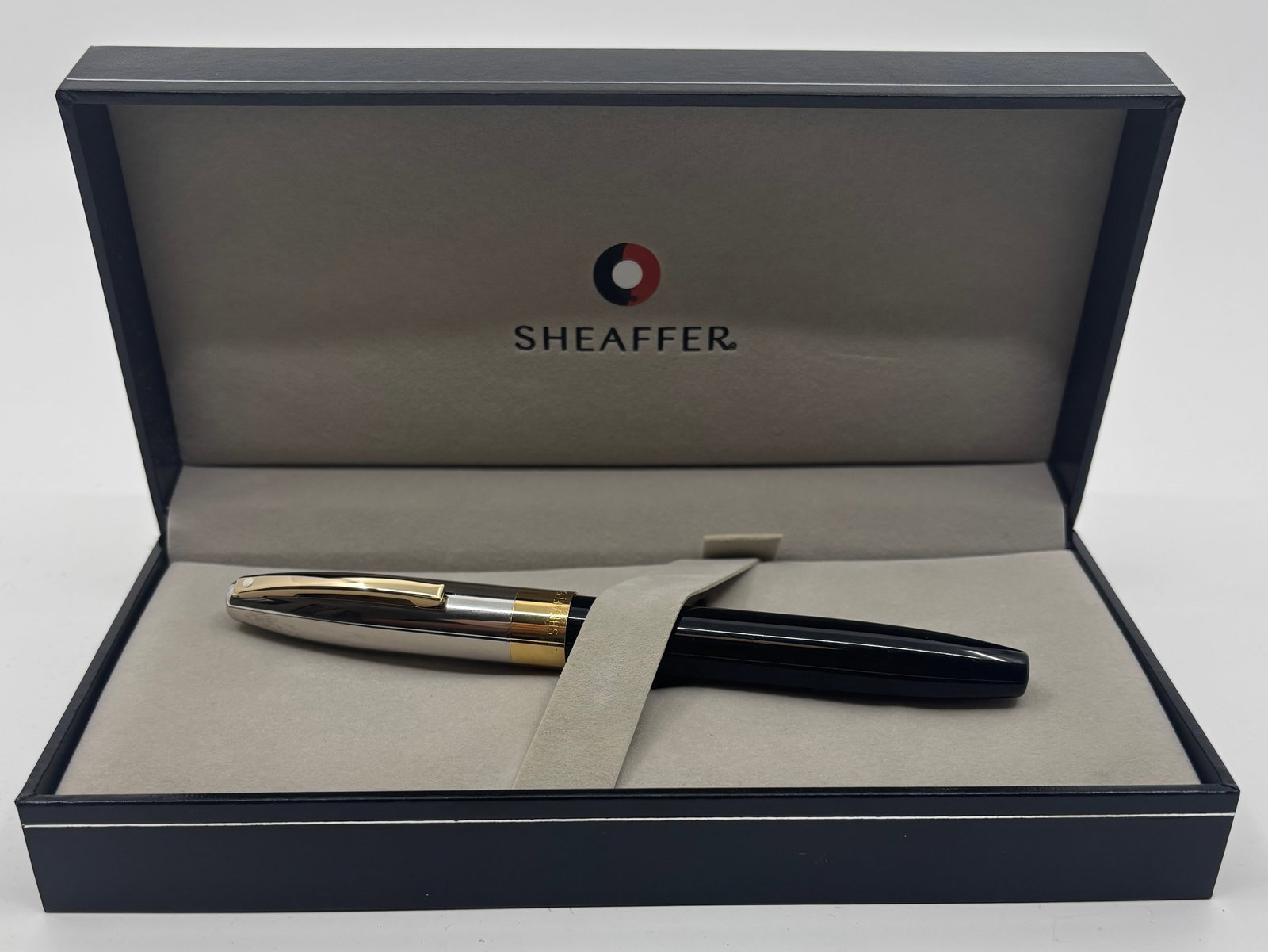 Sheaffer Legacy Heritage Palladium Plate Black 18K Nib Fountain Pen: Sheaffer Legacy Heritage Palladium Plate and black fountain pen with box, outer sleeve and papers. Sheaffer Legacy III model with 18K fine nib. Length 5 3/8” and 5 7/8” posted, filling