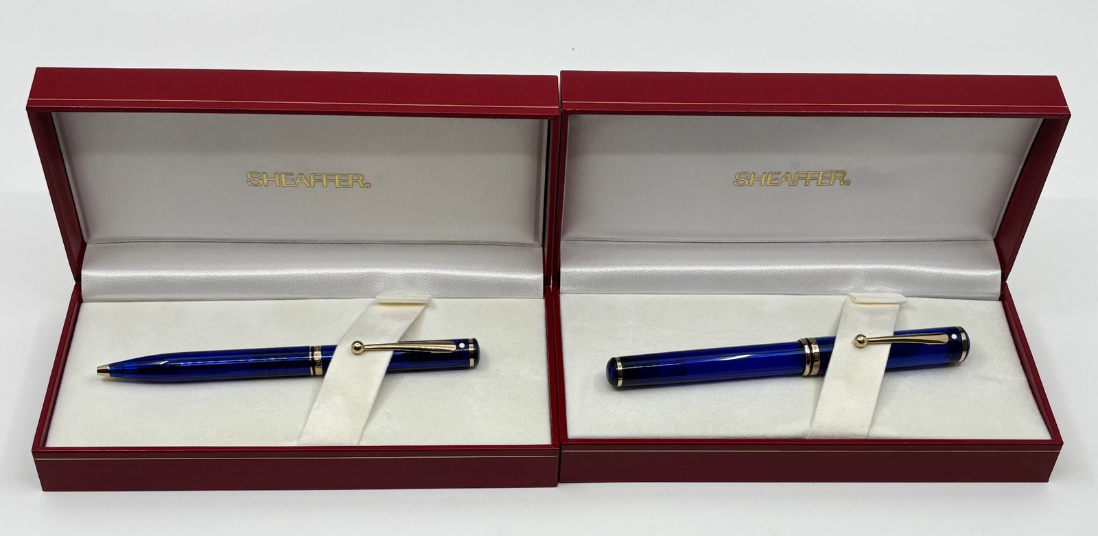 Sheaffer Connaisseur Mediterranean Blue Fountain Pen & Ballpoint Set: Sheaffer Connaisseur Mediterranean blue fountain pen and ballpoint with boxes, outer sleeves and papers. Transparent blue with gold trim and medium Sheaffer 18K nib. These pens were made for