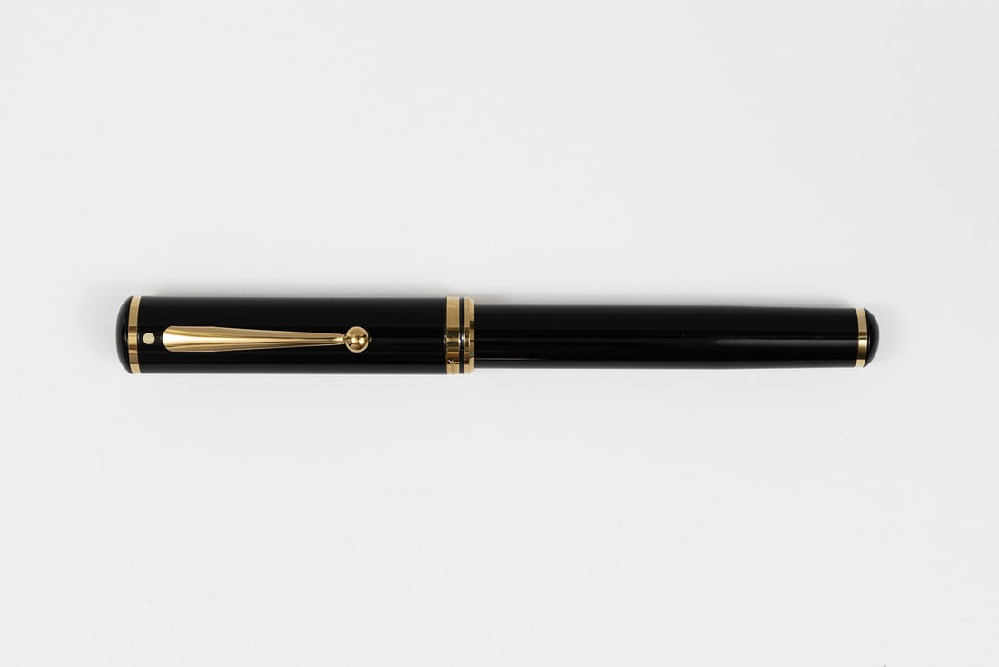 Sheaffer Connaisseur Black Fountain Pen, Boxed: Sheaffer Connaisseur black fountain pen with box and papers. Black with gold trim and fine Sheaffer 18K nib. Length 5 1/2” and 6 1/2” posted, filling mechanism cartridge/converter fill (co