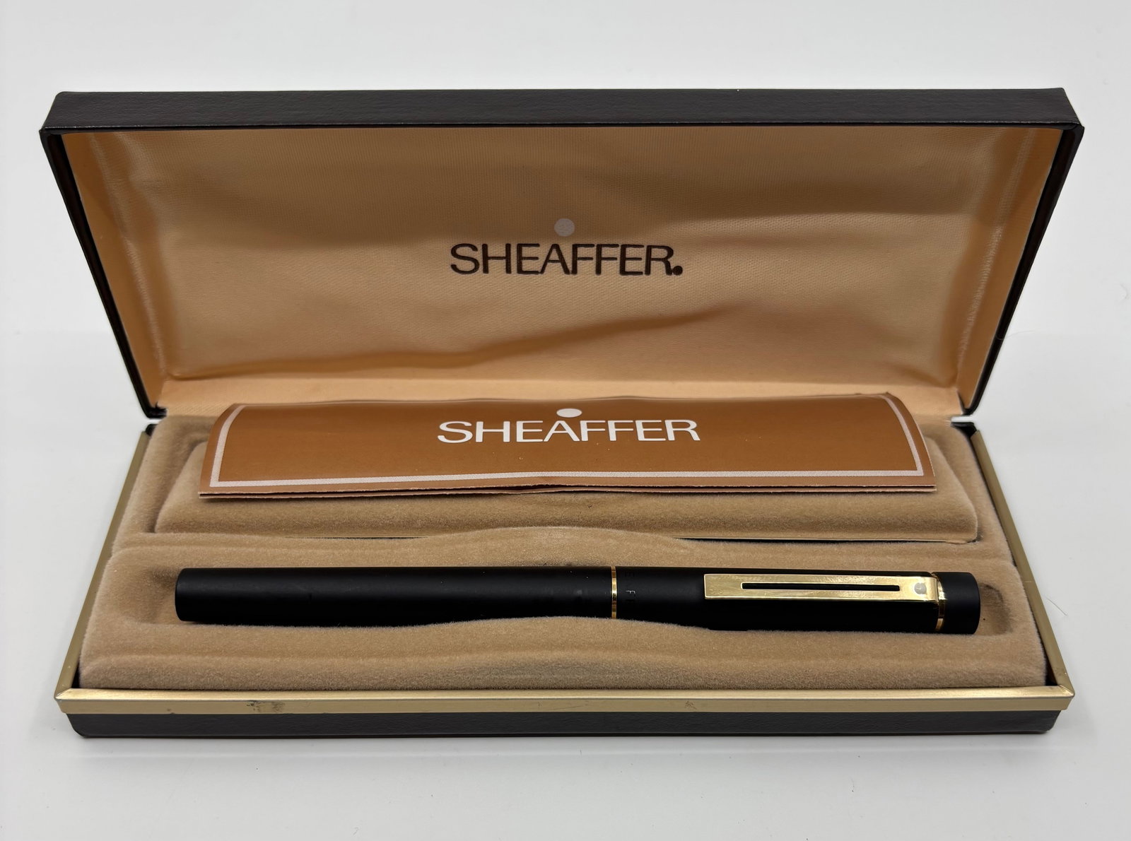 Sheaffer Targa Black Matte Fountain Pen, Org Stickers, Boxed: Sheaffer Targa 1003 Black Matte fountain pen with box and papers. Sheaffer Targa 1003 model, Black Matte with gold trim and medium 14K nib. Original M sticker and Sheaffer 1003 $75.00 on cap, gold M