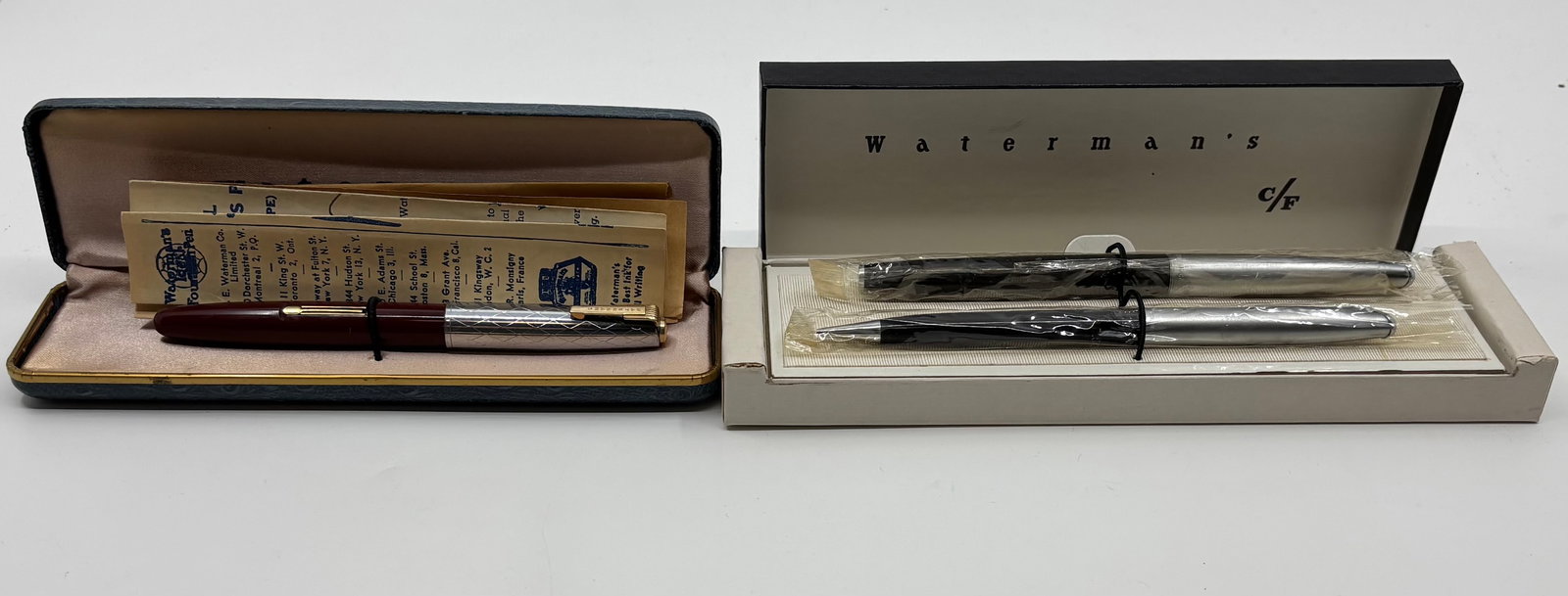 Waterman Taperite Fountain Pen & CF Set, Boxed: Waterman Taperite and CF set, boxed. Waterman Taperite in burgundy with silver plated diamond pattern cap and 14K fine nib along with CF 500 set in black with medium nib and brushed caps. Overall