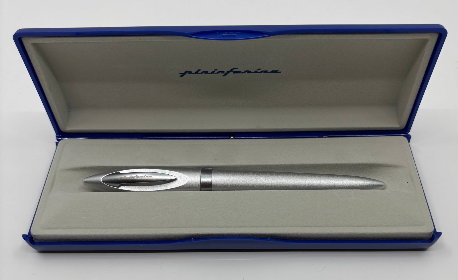 Pininfarina Brushed Silver Fountain Pen, Boxed: Pininfarina brushed silver fountain pen with box and outer box. Torpedo design with inset clip and medium steel nib. Overall near mind condition, appears to be unused, cartridge/converter fill