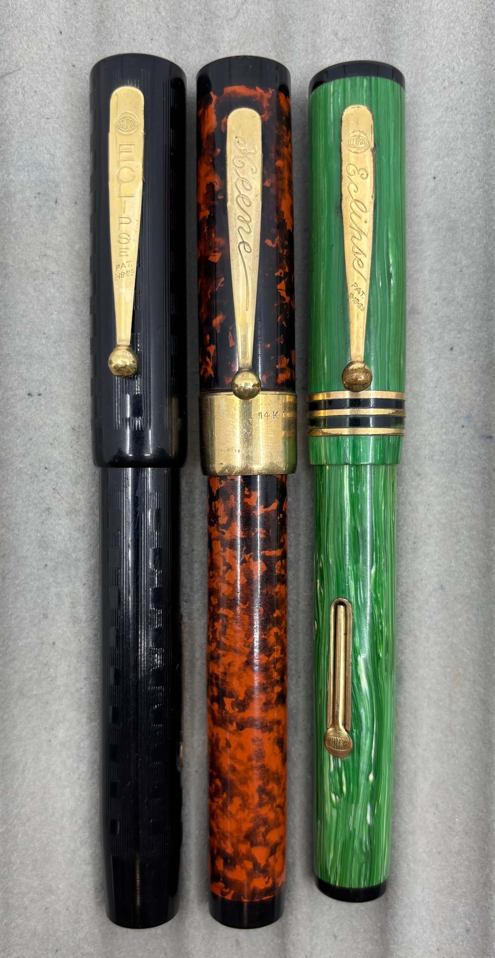 Eclipse Oversized Flattop Fountain Pens (3): Eclipse oversized flattop fountain pens (3). Oversized flattop pens by Eclipse, black chased style pattern on celluloid with 14K warranted fine flexible nib, Keene (Eclipse brand) red mottled style