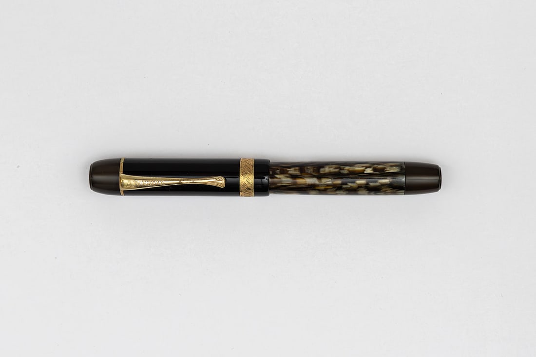 A.W Faber Castell Wertfüller Marbled Fountain Pen, Osmia Made: A.W. Faber Castell Wertfüller grey/black marble fountain pen, circa 1936. Made by Osmia after acquiring the company, marked A.W. Faber on clip and Castell on cap band with green and gold scale logo o