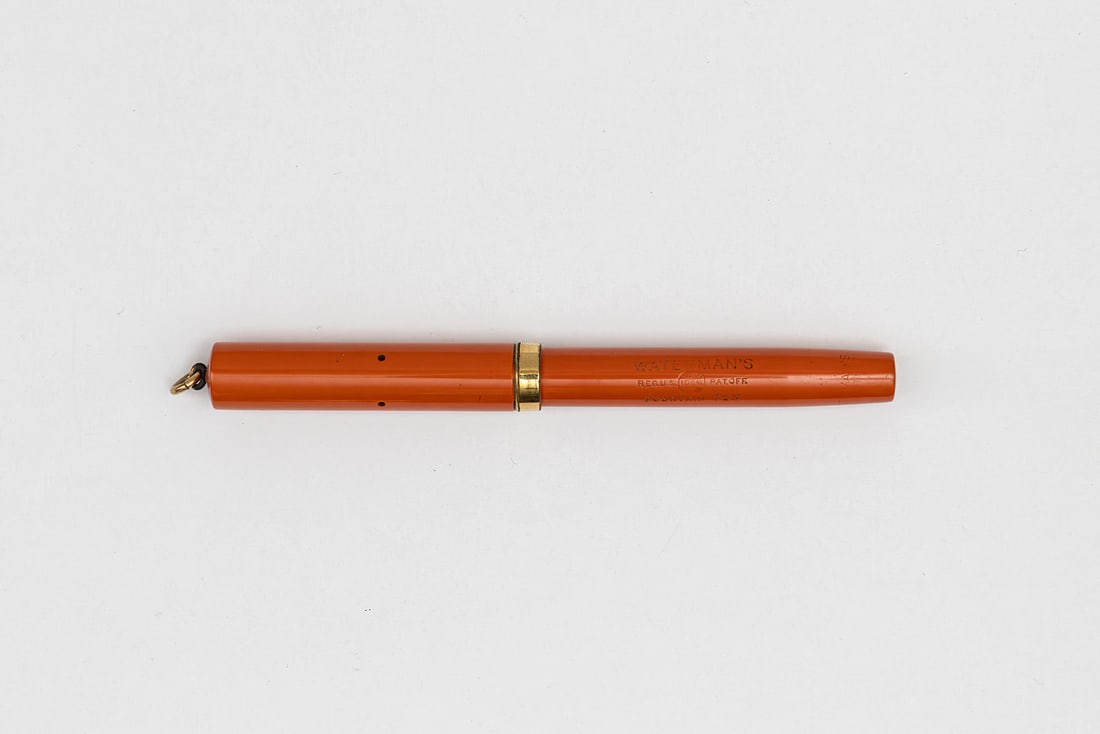Waterman Ideal 52 1/2 V Red Hard Rubber Fountain Pen: Waterman Ideal 52 1/2 V red hard rubber fountain pen, circa 1925. Waterman Ideal 52 1/2 V red hard rubber fountain pen with gold filled trim and Waterman 2 14K fine nib and matching feed. Length 4 1/4