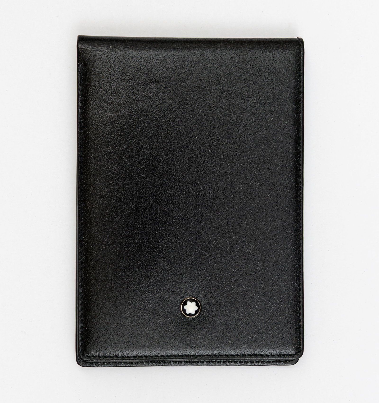 Montblanc Pen Black Leather Notebook: Montblanc pen company black leather pocket notebook. 30650 example that extends vertically with paper pad measuring 4 3/4” by 3 1/4”. Overall excellent condition.