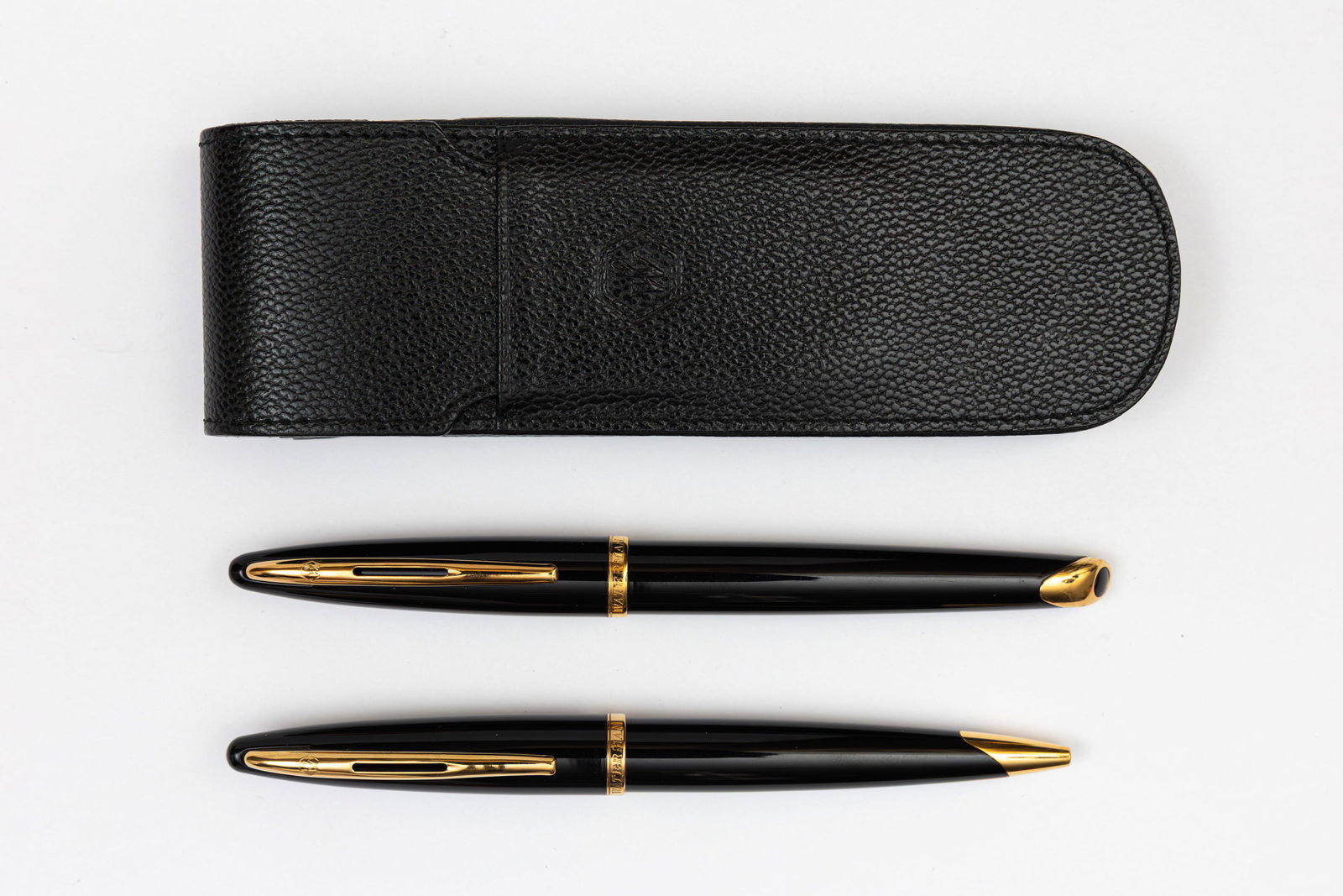 Waterman Carene Black Lacquer Fountain Pen Set & Leather Case: Waterman Carene black lacquer fountain pen and ballpoint set in Waterman leather case. Black laque with gold trim with 18K fine nib and faux pebbled leather black Waterman case. Length 5 5/8” an