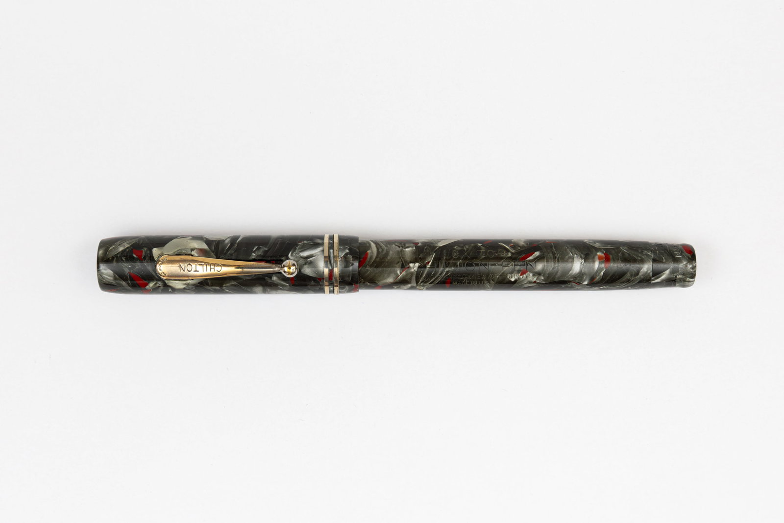 Chilton Lox-Top Grey Marble & Red Fountain Pen: Chilton Lox-Top Long Island grey marble and red fountain pen. Lox-Top model with stopper under clip that locks into place on the grooved section to keep the cap from coming unscrewed in ones pocket, p