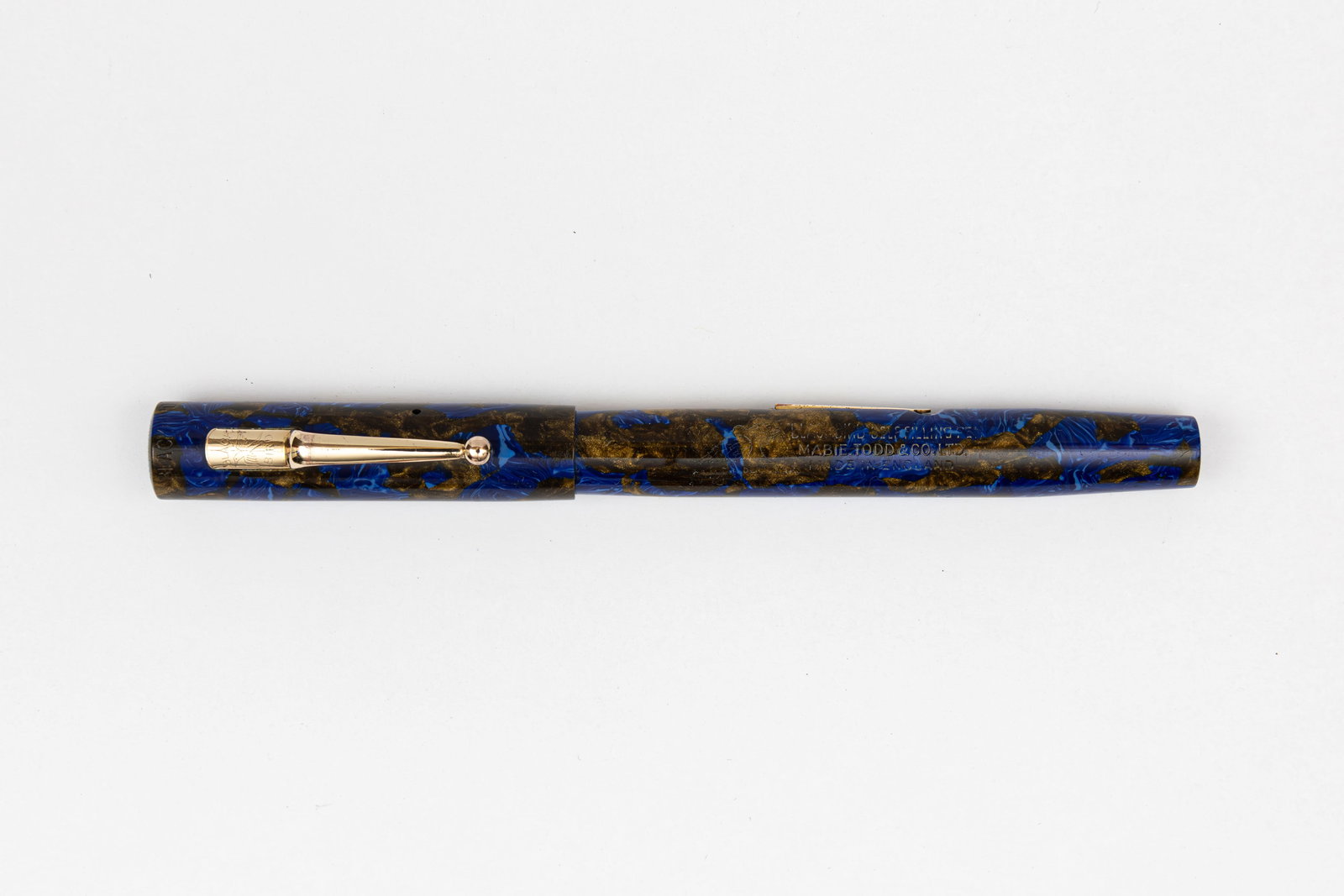 Mabie Todd Swan Blackbird BB2/46 Blue/Bronze Fountain Pen: Mabie Todd Swan Blackbird BB2/46 blue/bronze marble fountain pen. Crisp imprints with bright colour and Blackbird 14K medium tipped flexible nib. Length 5 1/4” and 6 1/2” posted, filling m