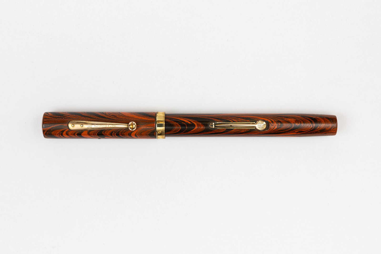 Waterman Ideal 52 Red Ripple Fountain Pen: Waterman Ideal 52 Red Ripple fountain pen. The Ripple pattern appears to have first launched in the Waterman Pen Prophet magazine in 1926. Waterman was competing with Sheaffer and Parker's celluloid m