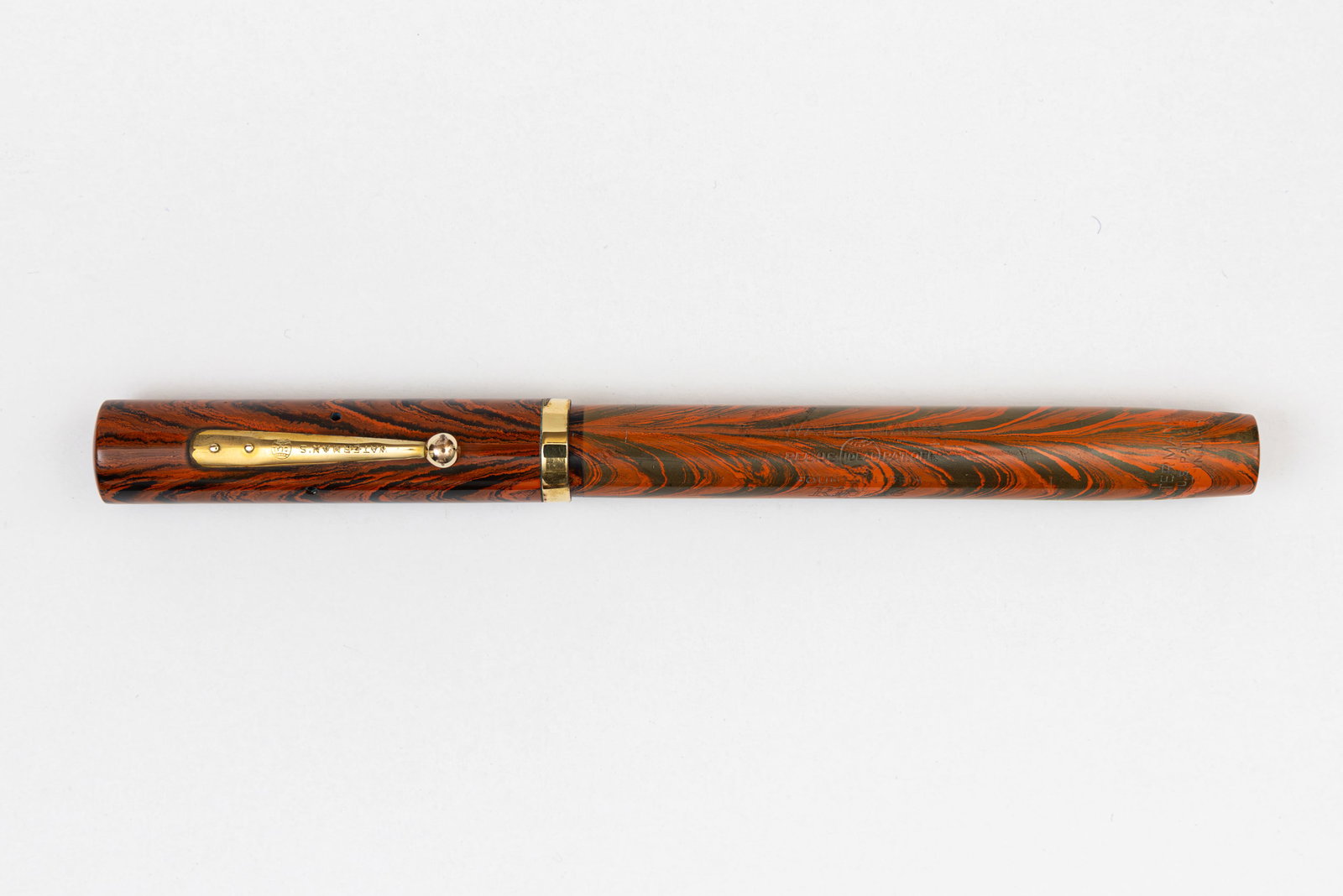 Waterman Ideal 54 Red Ripple Fountain Pen: Waterman Ideal 54 Red Ripple fountain pen. The Ripple pattern appears to have first launched in the Waterman Pen Prophet magazine in 1926. Waterman was competing with Sheaffer and Parker's celluloid m