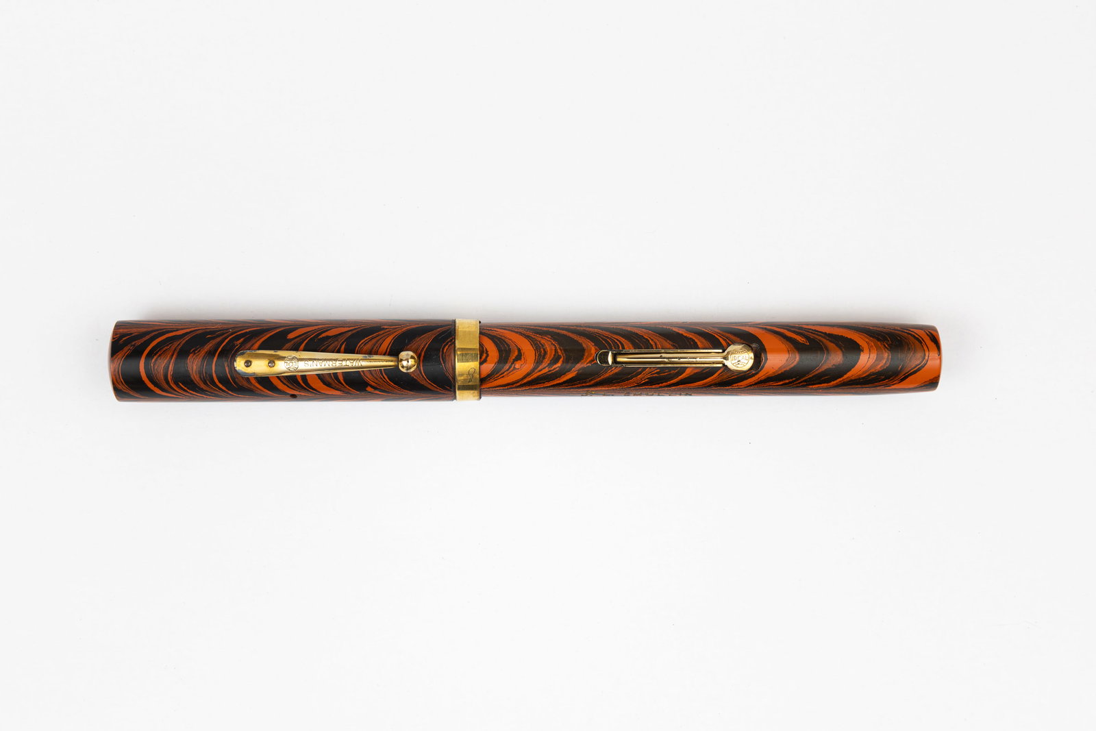 Waterman Ideal 56 Red Ripple Fountain Pen: Waterman Ideal 56 Red Ripple fountain pen. Larger 56 size hard rubber fountain pen in Red Ripple pattern with gold filled trim. Legible imprints, good colour with some brassing to edges of lever with