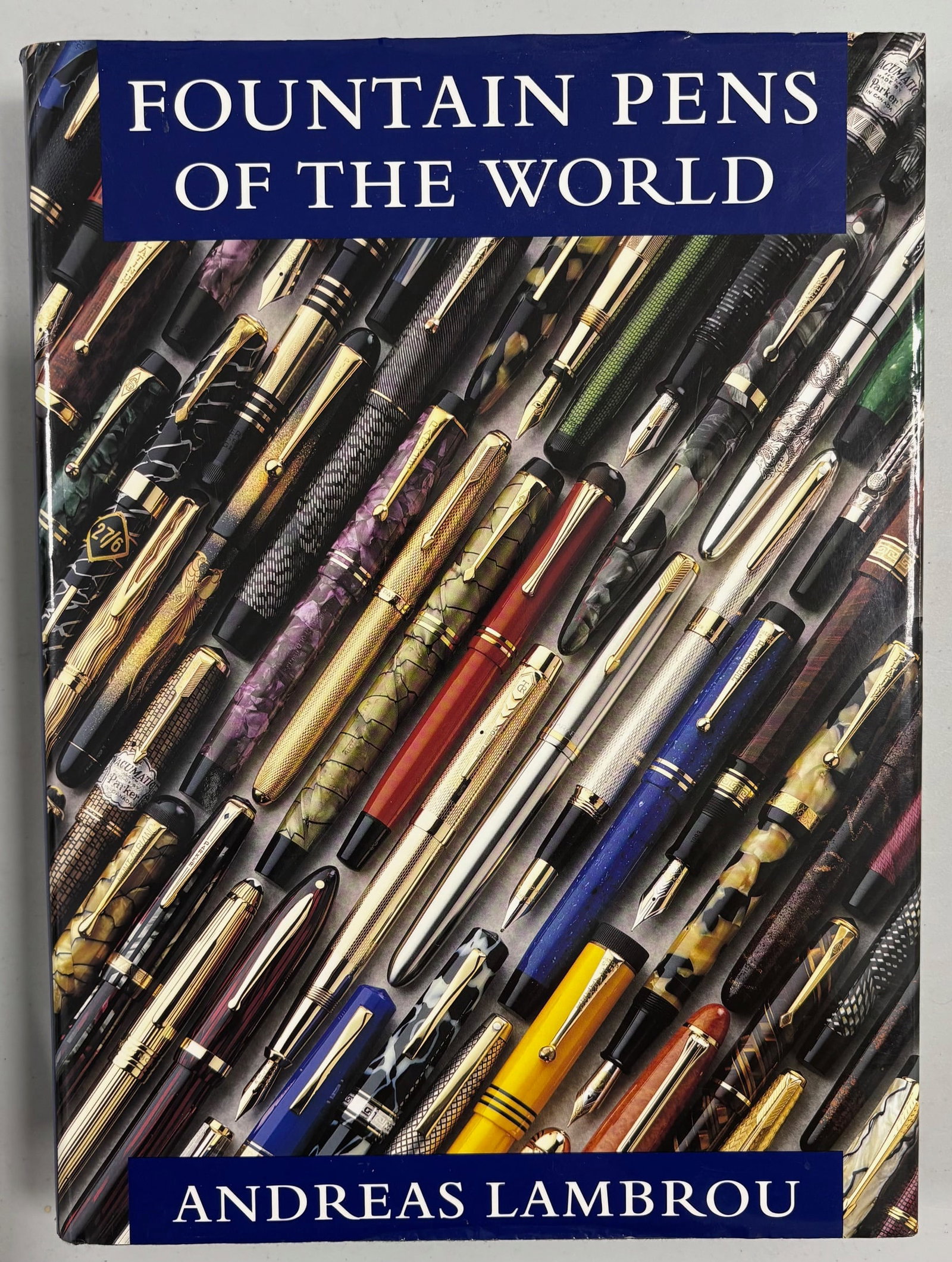 Fountain Pens of the World, Book by A Lambrou: Fountain Pens of the World by A Lambrou. Large detailed book on fountain pens and pen collecting by Andreas Lambrou, Fountain Pens of the World, 448 pages, hardcover with dust jacket. Overall good