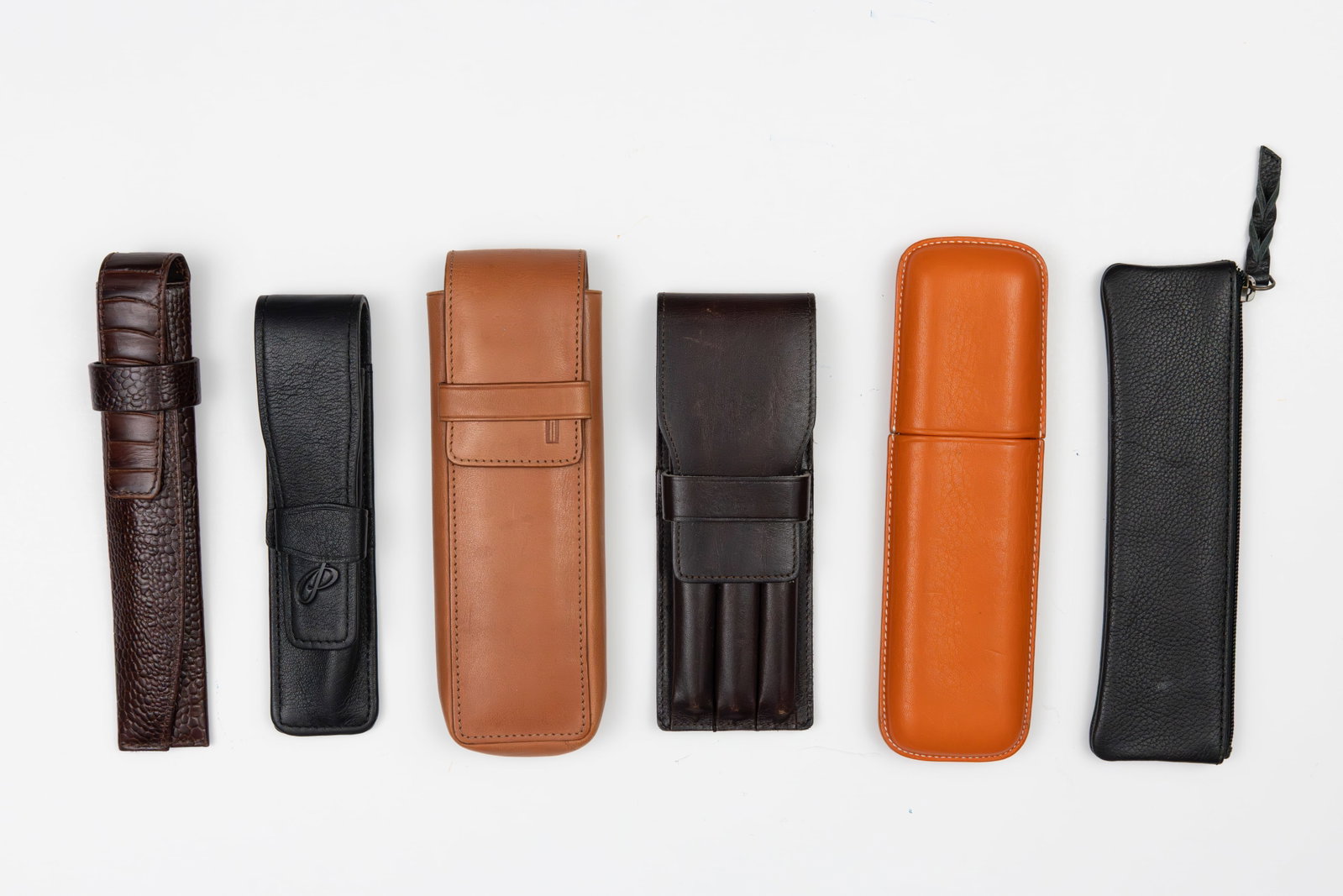 Assorted Leather Pen Cases (6), Yard-O-Led, Lamy, Parker, Wahl: Assorted pen cases (6) Assorted leather and faux leather pen cases by Yard-O-Led, Lamy, Parker, Wahl Eversharp, Hartmann and Recife. Overall good condition.