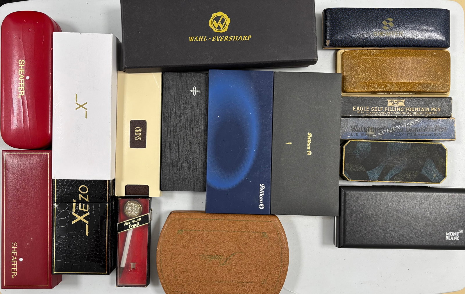 Assorted Modern and Vintage Fountain Pen Boxes: Assorted pen boxes (17). Several early boxes from Eagle, Waterman and others. Vintage and modern pen boxes from Montblanc, Parker, Pelikan, Sheaffer, Wahl Eversharp, Waterman and others. Overall good