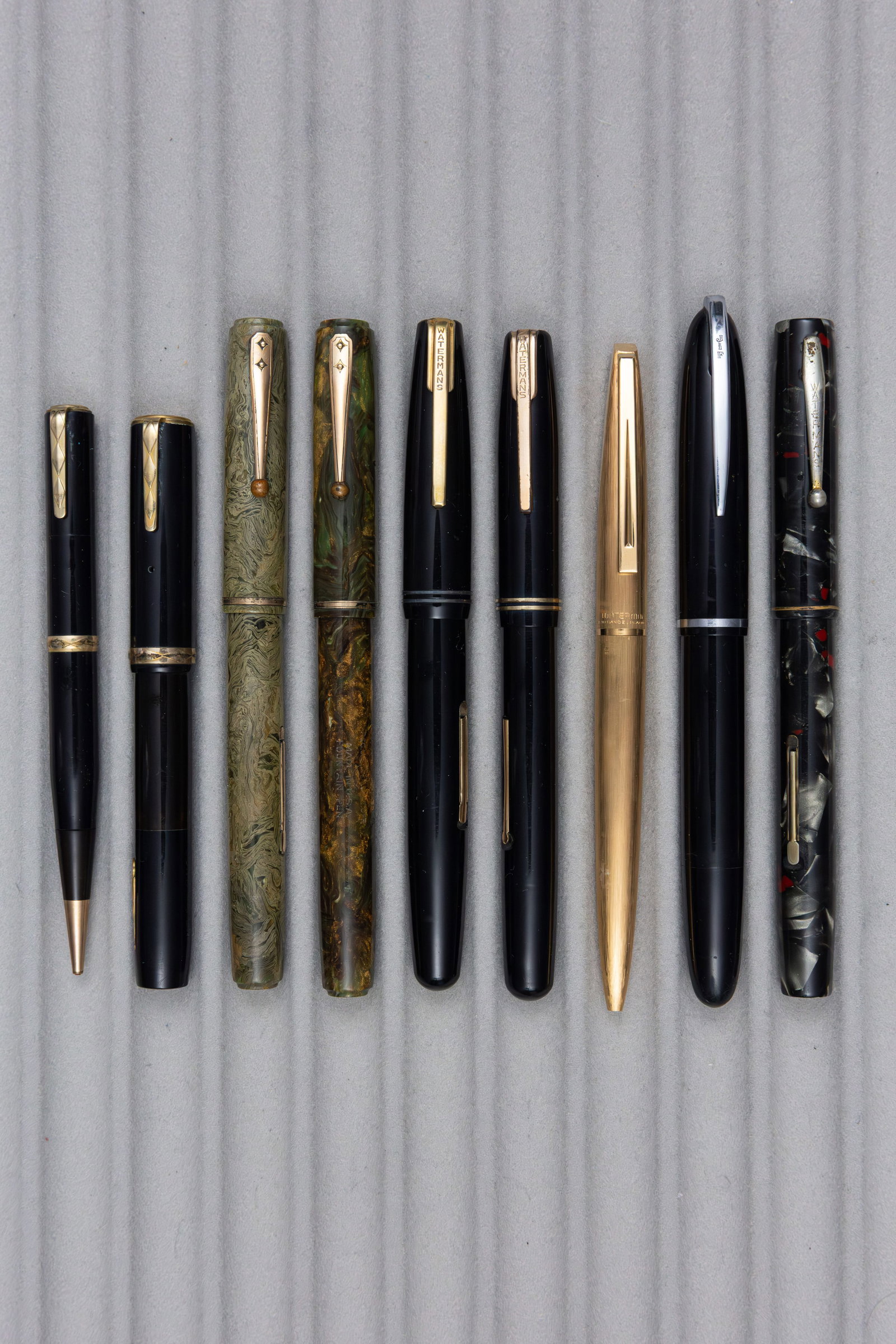 Waterman Fountain Pens and Pencil Lot (9): Waterman fountain pen and pencil lot (9). Assorted Waterman fountain pens, all with 14K and 18K nibs (one cracked), several flexible along with matching Lady Patricia pencil to pen and French gold pla