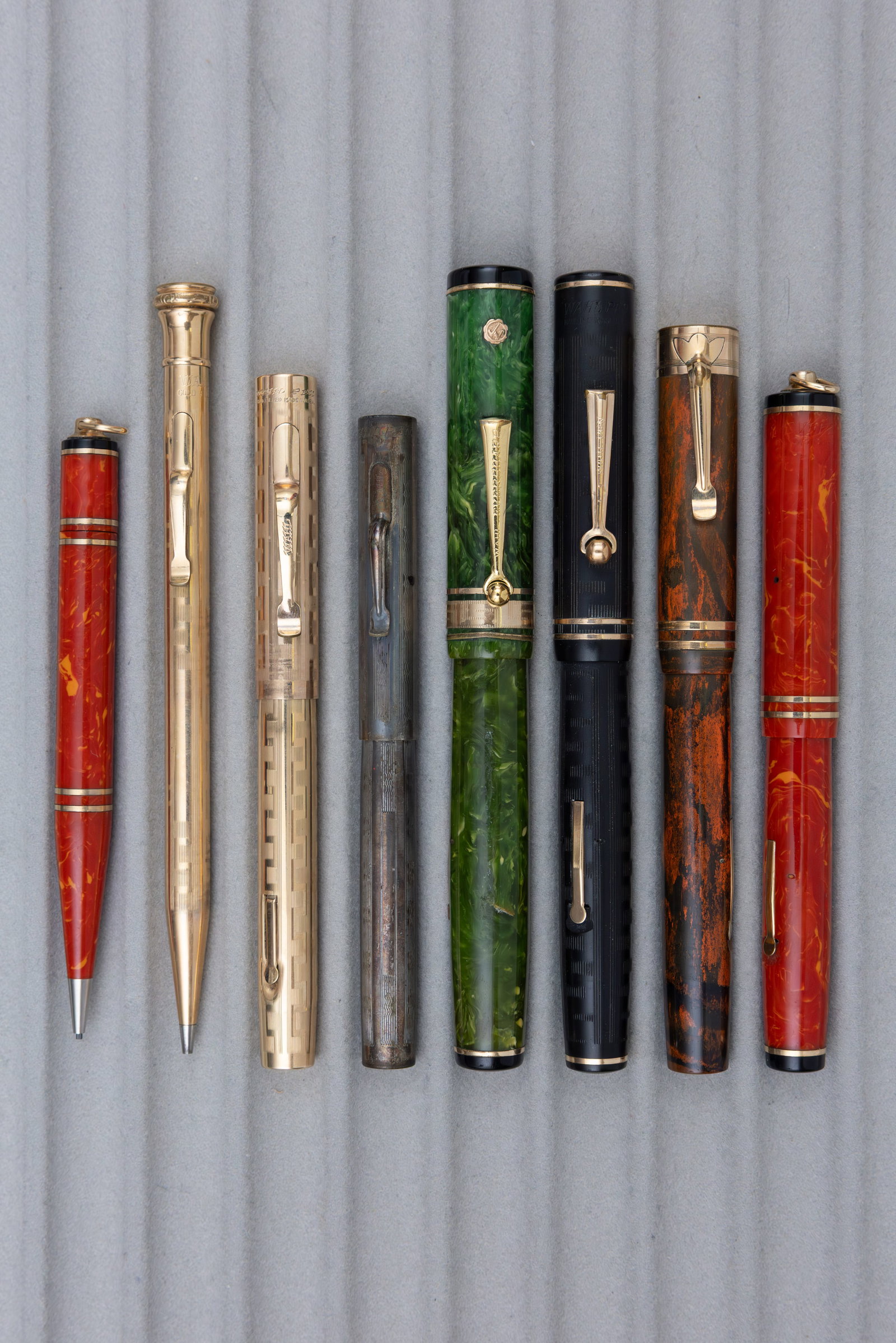 Wahl Eversharp Fountain Pens and Mechanical Pencils (8): Wahl Eversharp fountain pens and mechanical pencils (8). Wahl Eversharp lot, oversized Gold Seal in Jade, Coral and gold filled sets, along with silver filled, black chased hard rubber and red mottled
