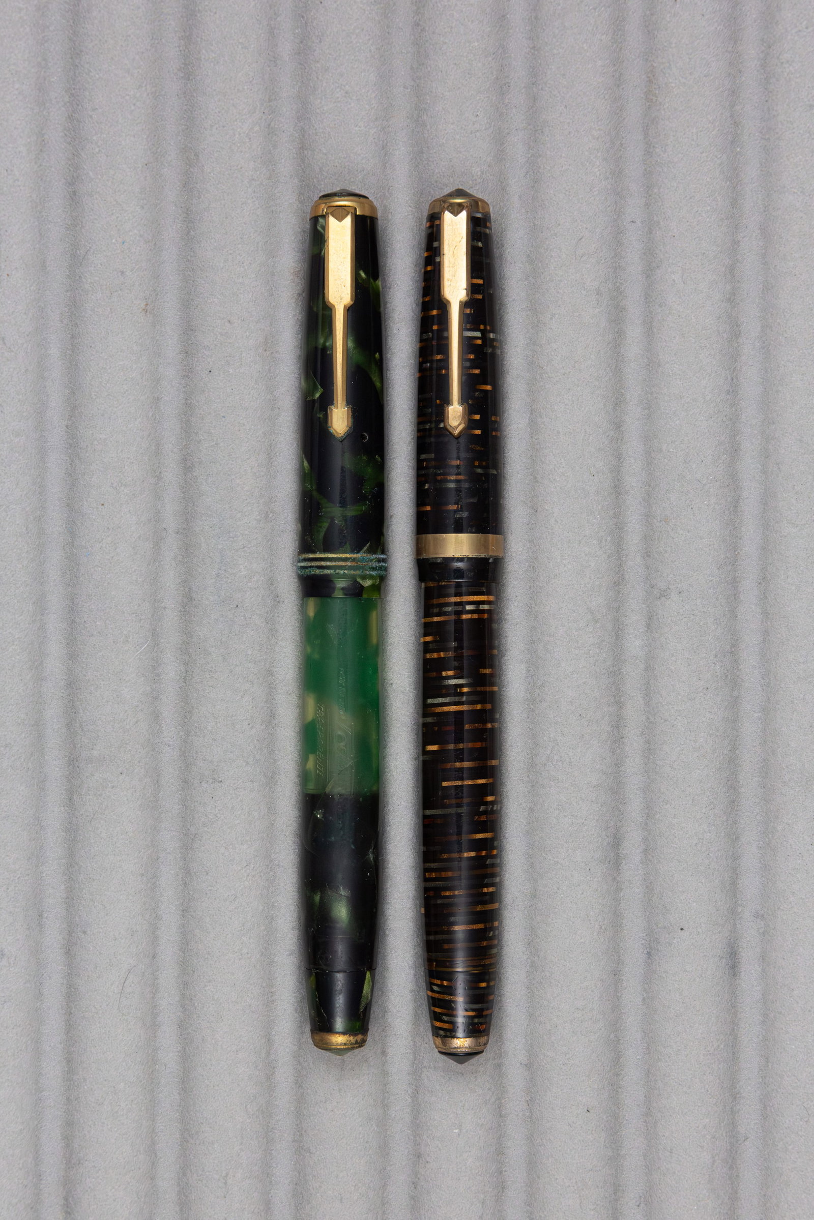 Tabo Transparente Fountain Pens (2), Flawed: Tabo Transparente fountain pens (2). Tabo Transparente Italian made fountain pens with Tabo 8 14K fine flexible nibs. Length 5 1/8 inches and 6 1/8 inches posted, filling mechanisms piston fill. Overa
