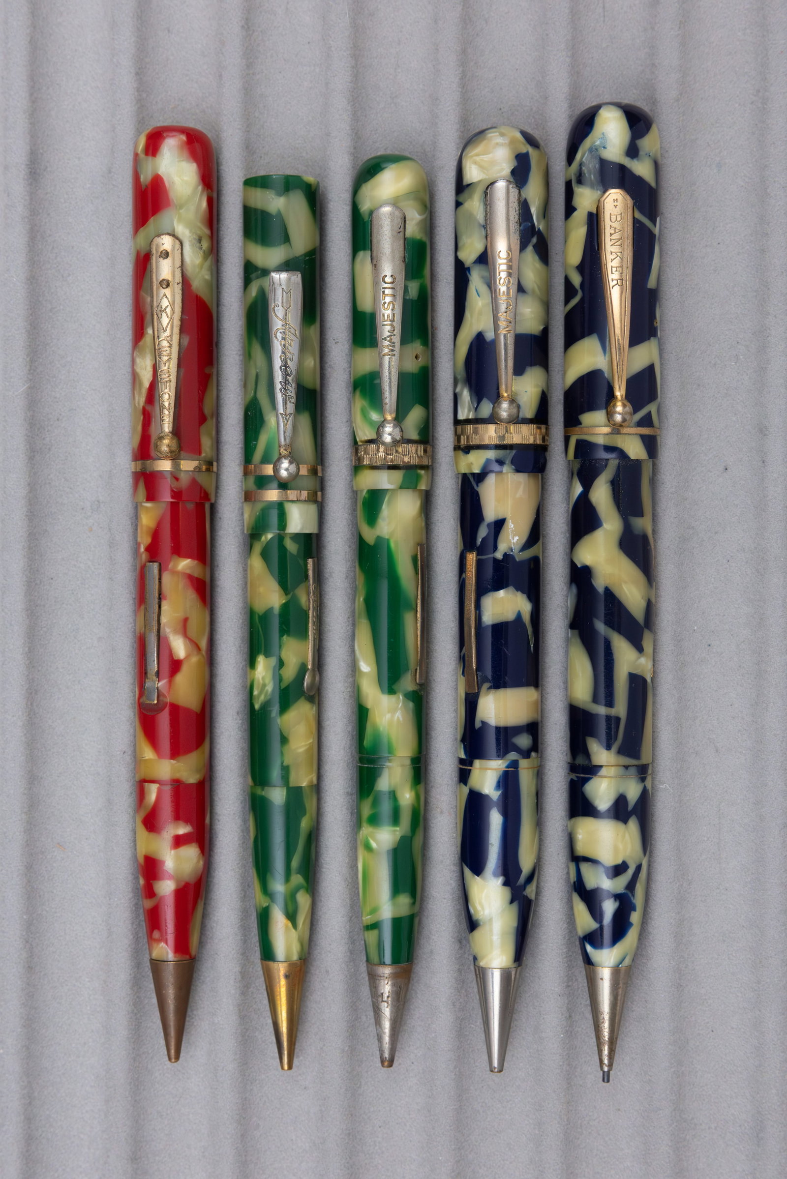Schnell Celluloid Banker, Keystone, Majestic Fountain Pen Pencil Combos (5): Schnell celluloid fountain pen, pencil combinations by other makers (5). Schnell at the end of their production appeared to have sold off unmarked or unfinished pens to other makers. These pens in red