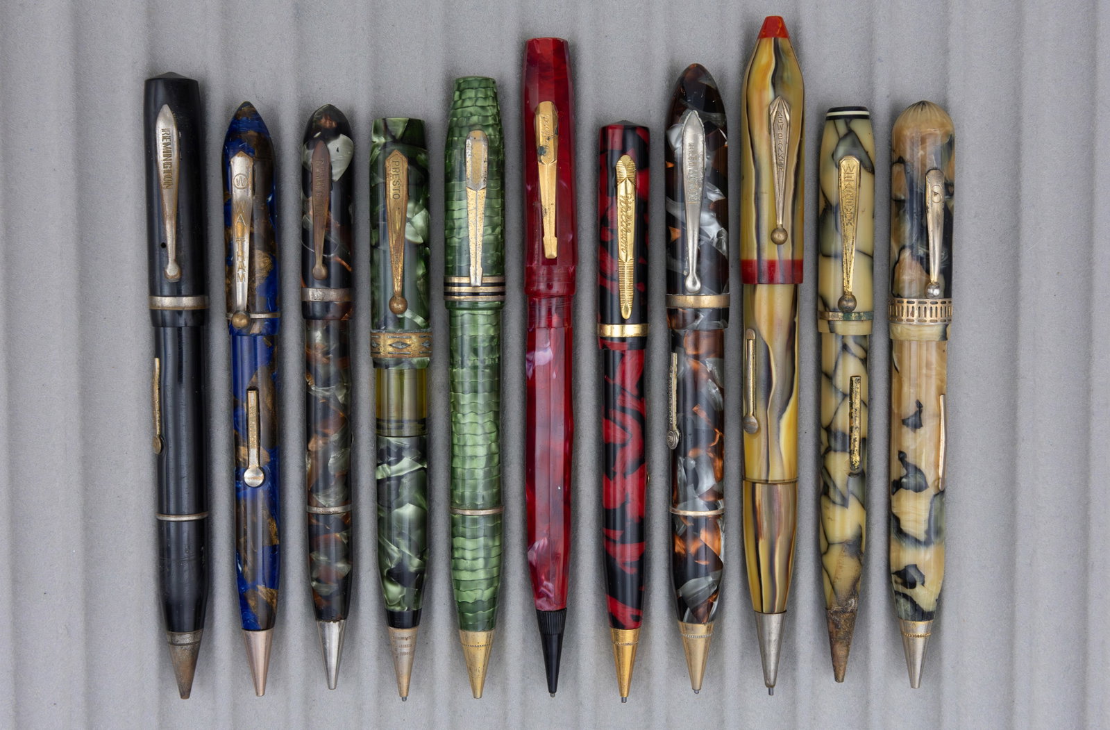 Assorted Marbleized Fountain Pen Pencil Combinations (11), Lot H: Assorted celluloid fountain pen/pencil combos (11). This lot consists of brands from M to Z alphabetically, brands such as New Banker, Remington, Waltham, Wearever and others can be found in these
