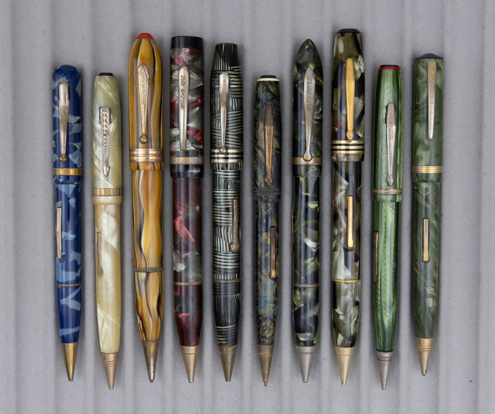 Assorted Marbleized Fountain Pen Pencil Combinations (10), Lot G: Assorted celluloid fountain pen/pencil combos (10). This lot consists of brands from M to Z alphabetically, brands such as New Banker, Remington, Waltham, Wearever and others can be found in these