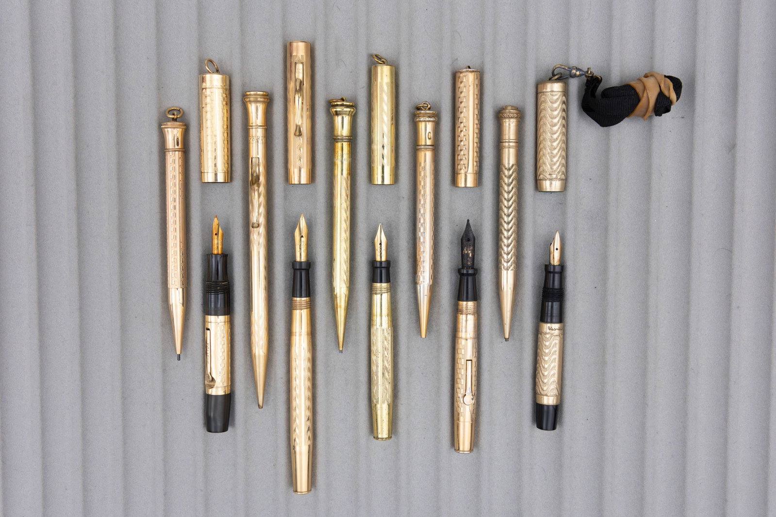 Assorted Gold Filled Fountain Pen and Pencil Sets (5), Boxed: Assorted gold filled fountain pen and pencil boxed sets (5). Sets include Eclipse, Morrison, Superite (2) and unmarked. All fountain pens with 14K solid gold nibs other than the unmarked set with