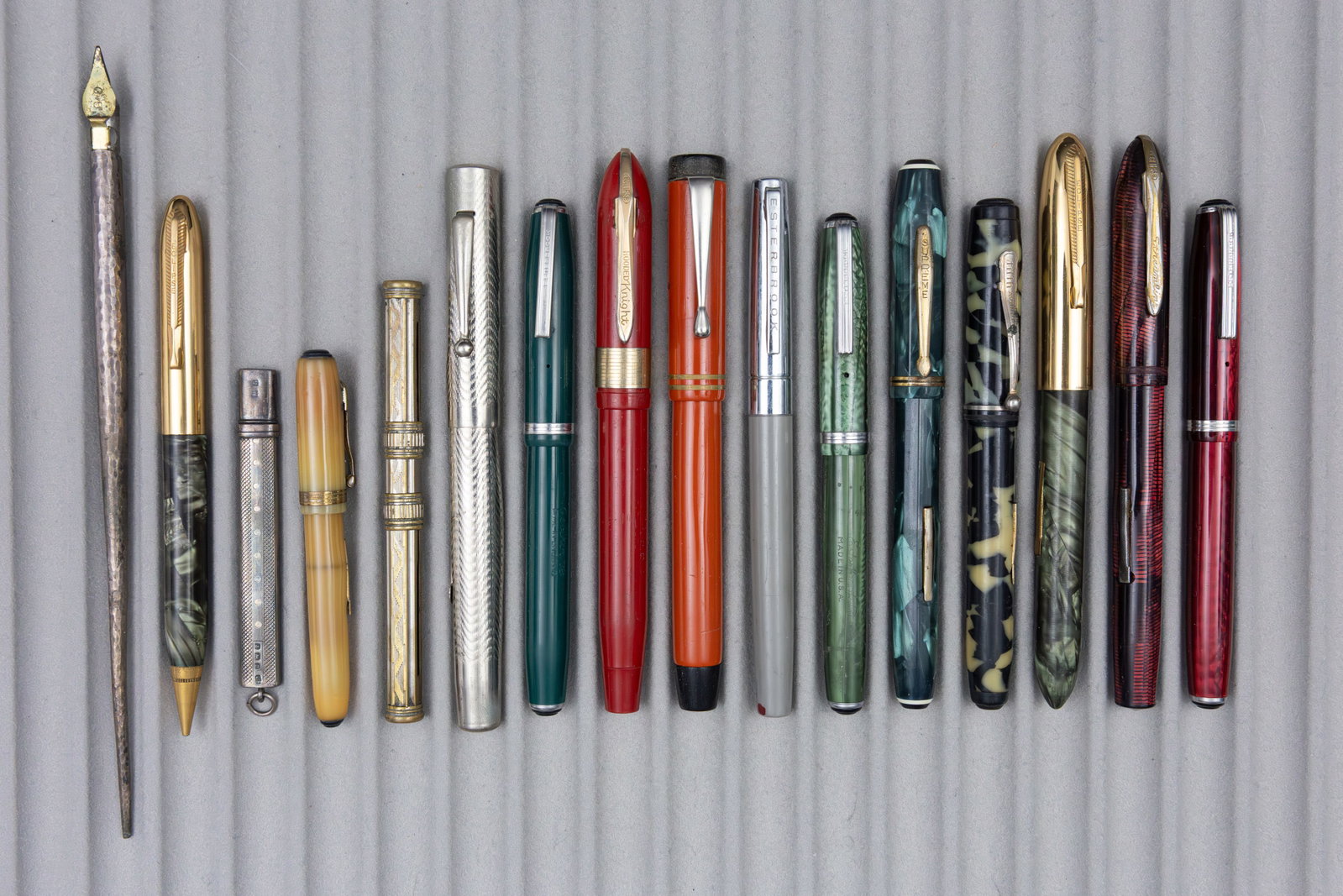 Assorted Vintage Fountain Pens, Pencils, Eclipse, Esterbrook, Others (16): Assorted vintage fountain pens and pencils (16). Lot includes Esterbrook fountain pens (4). Eclipse fountain pens (2), one silver dip pen and sterling silver flat pencil along with additional pens
