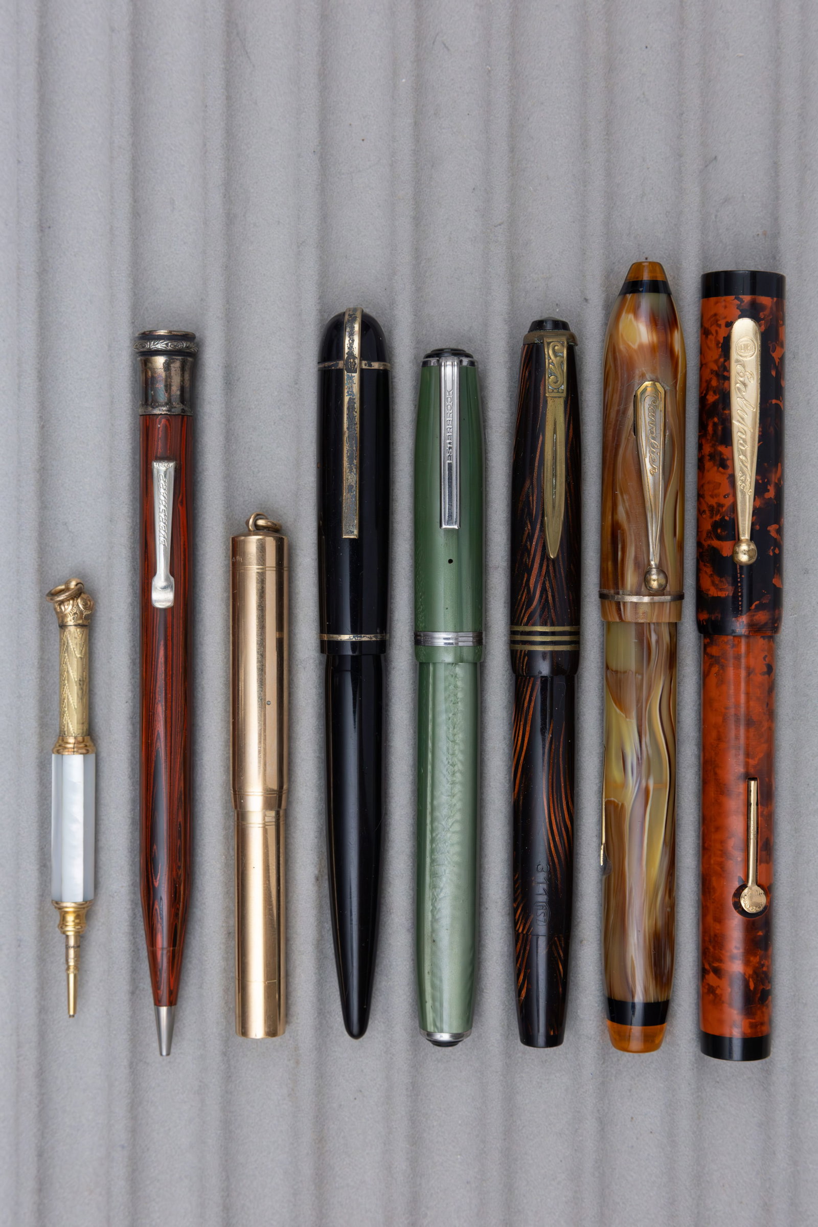 Assorted Fountain Pens, Pencils, Eclipse, Pearl, Wahl Eversharp, Others (8): Assorted fountain pens and pencils (8). Assorted fountain pens and pencils, pens include with 14K gold nibs by Cavalier, Eclipse, Sigma and Wahl Eversharp, an Esterbrook J in green with steel nib and