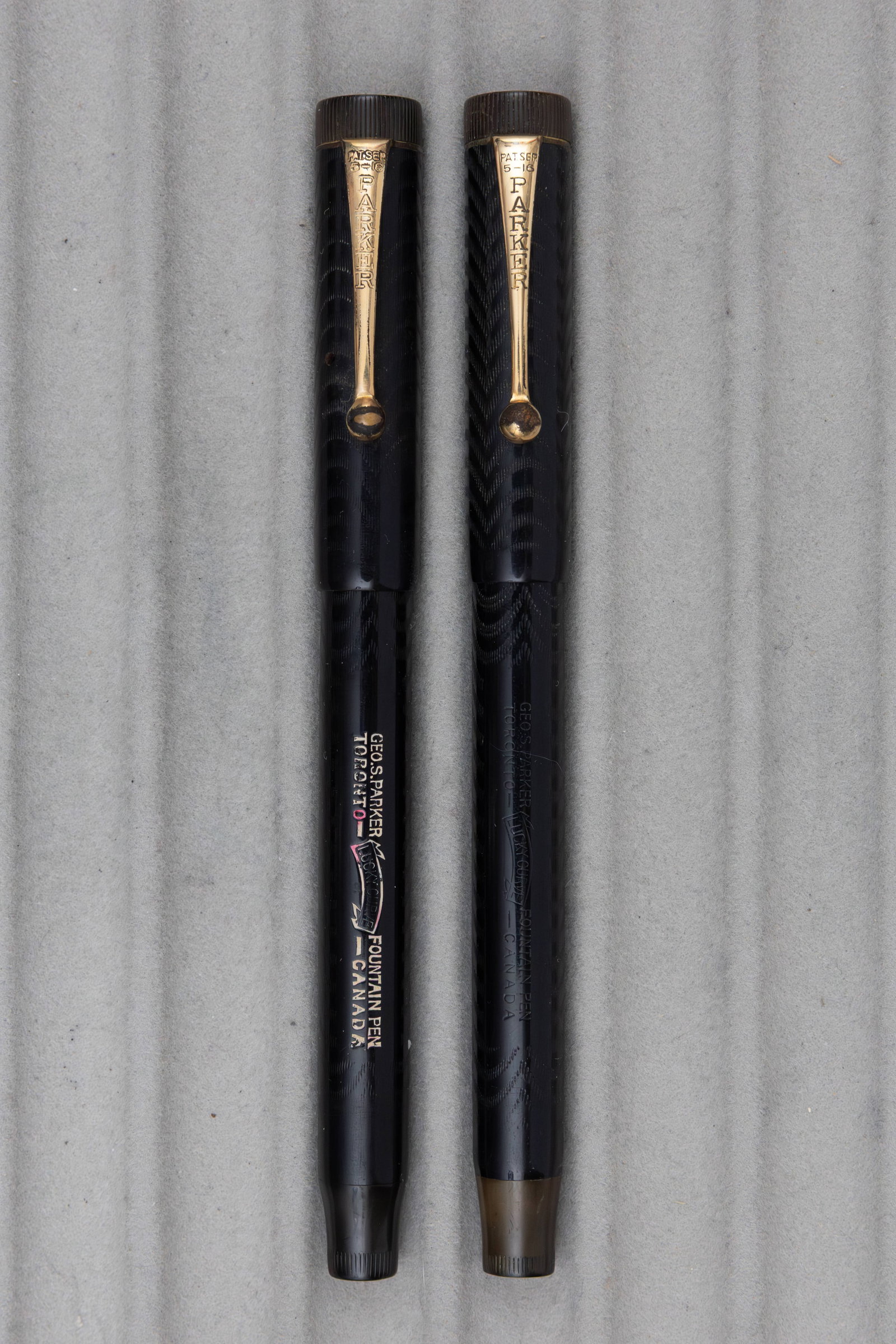 Parker 20 1/2 Lucky Curve Black Chased Fountain Pens, Flexible Nibs: Parker 20 1/2 Lucky Curve black chased hard rubber fountain pens. Both made in Toronto, one with earlier keyhole 14K fine flexible nib, the other with broad 14K flexible nib, both marked Parker Lucky
