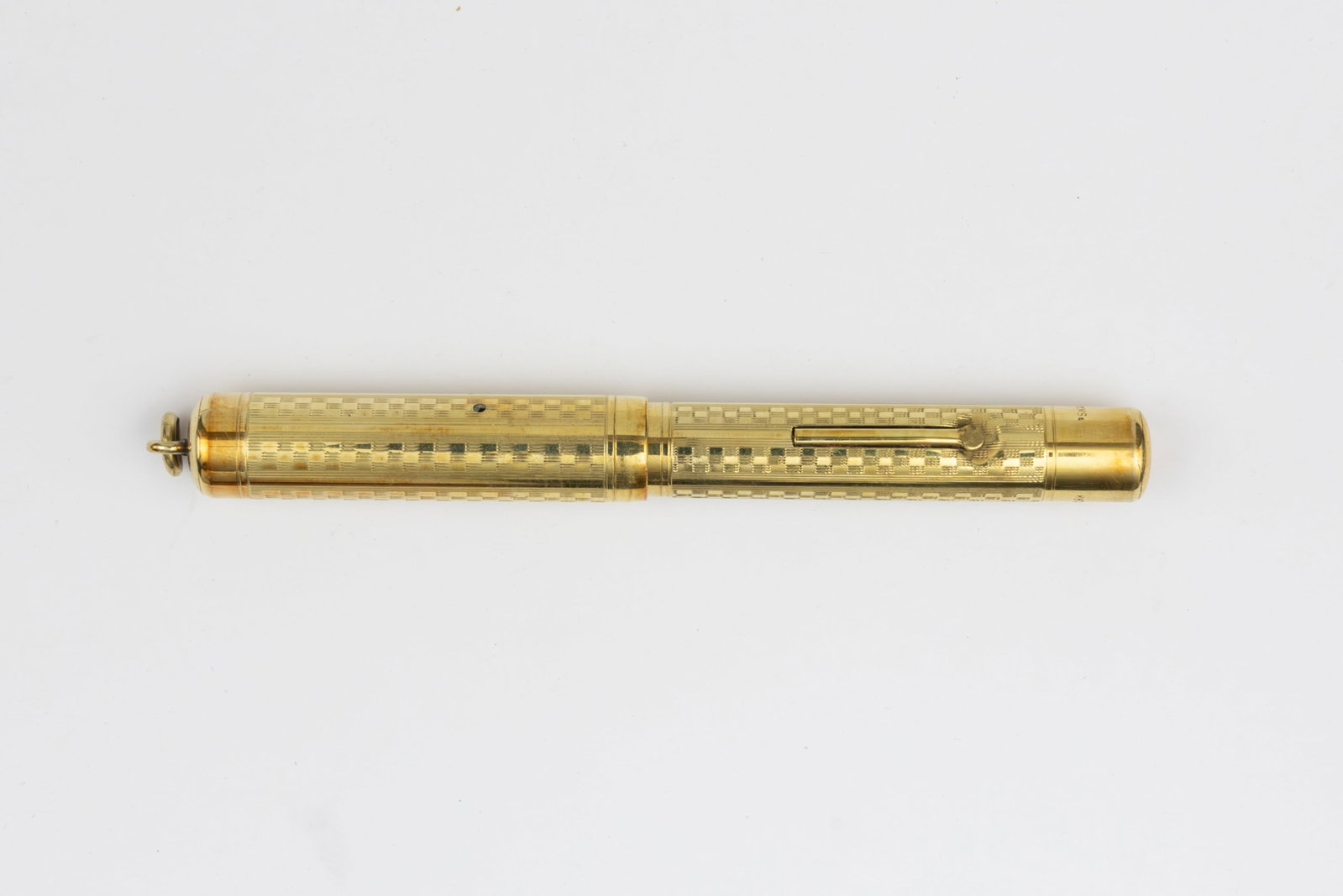 Mabie Todd Swan Gold Filled Ring Top Fountain Pen: Mabie Todd Swan gold filled ring top fountain pen. Mabie Todd Swan gold filled ring top fountain pen with engine turned design and Mabie Todd and Co 14K fine flexible nib. Length 4 inches and 5 1/4