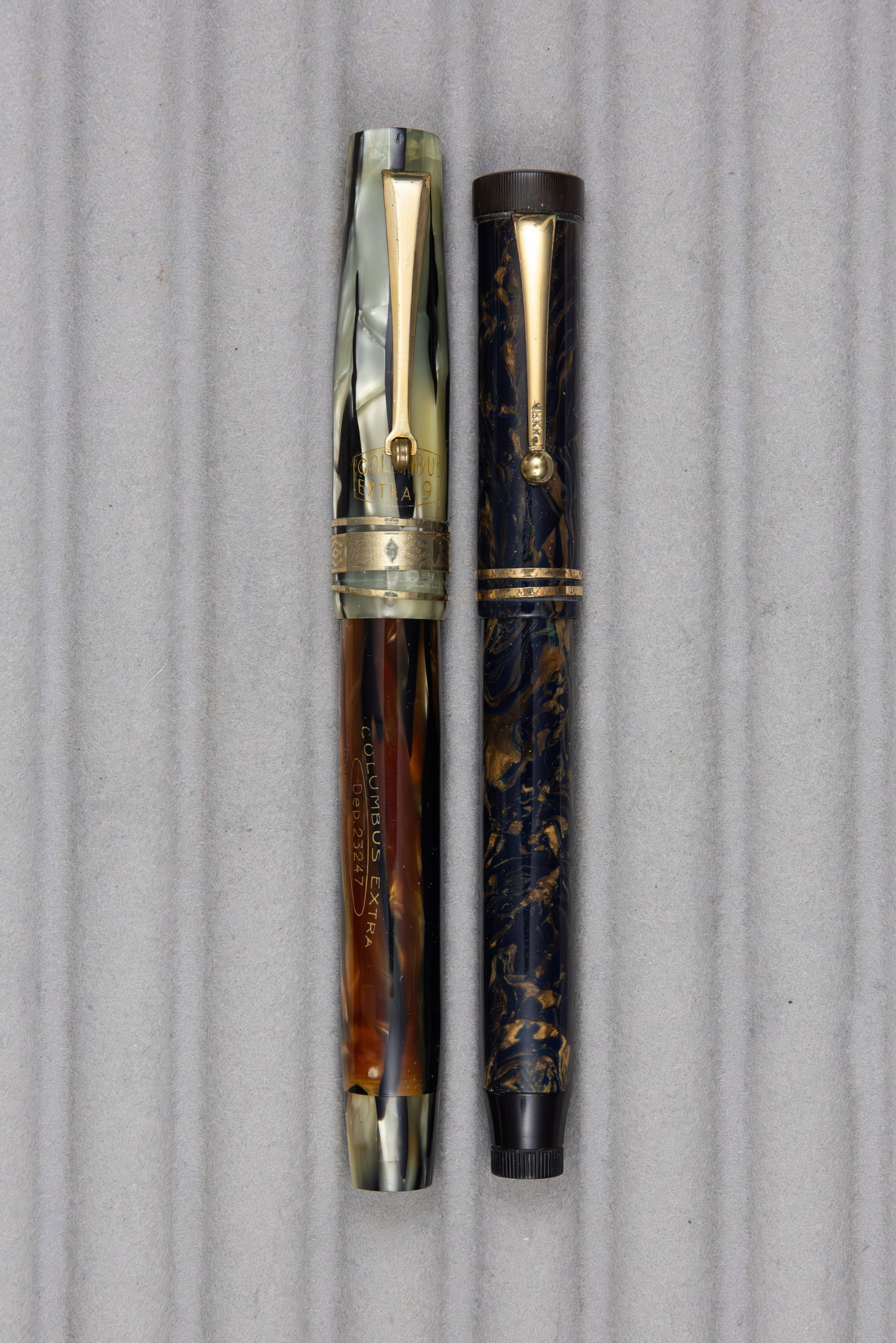 Italian Celluloid Fountain Pens, Columbus and Other, Flexible Nibs: Italian celluloid fountain pens. Columbus Extra 98 with paddle lever in black and pearl with roller clip and Deco cap band with fine flexible Columbus 14K nib along with blue and bronze pen with